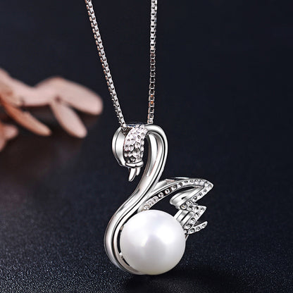 Delicate silver swan necklace with pearl pendant