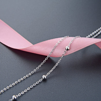 Dainty silver necklace layered