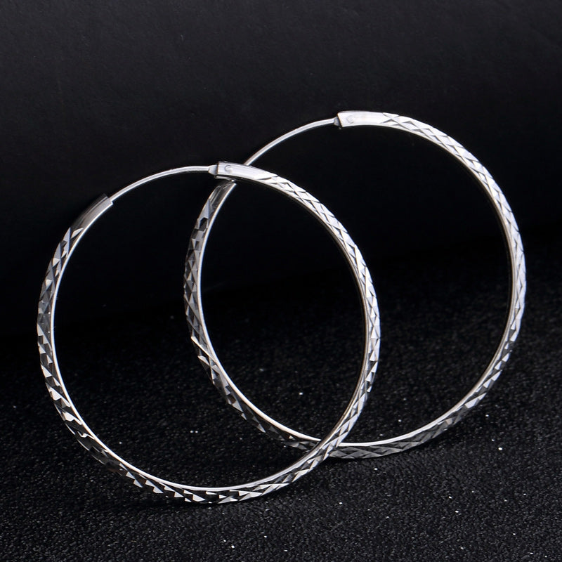 Fancy silver hoop earrings