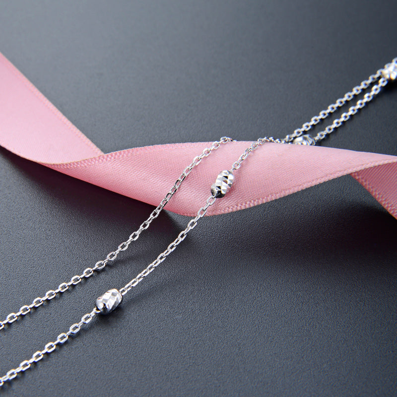 Delicate silver necklace layer