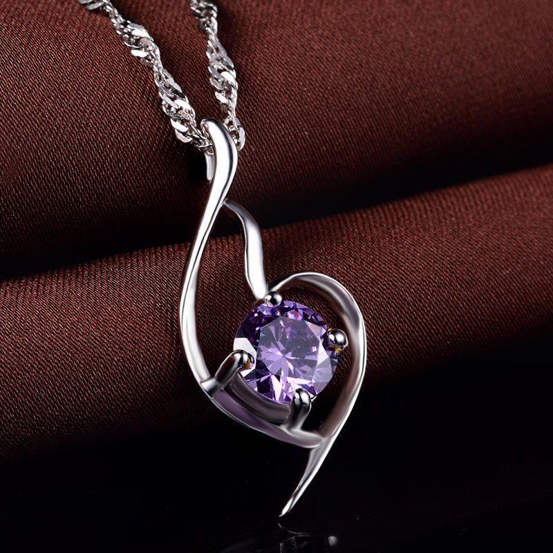 Unique small silver heart necklace