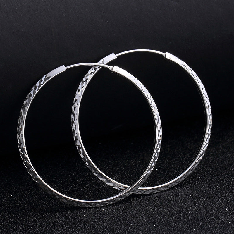 Fancy silver hoop earrings